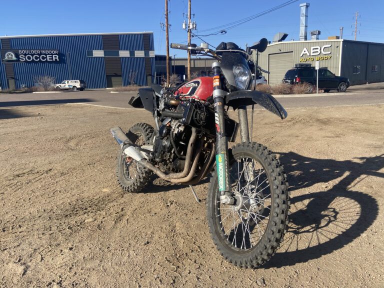 Finished KTM 450 adventure bike with the GSX-R600 engine and a red tank, parked outside