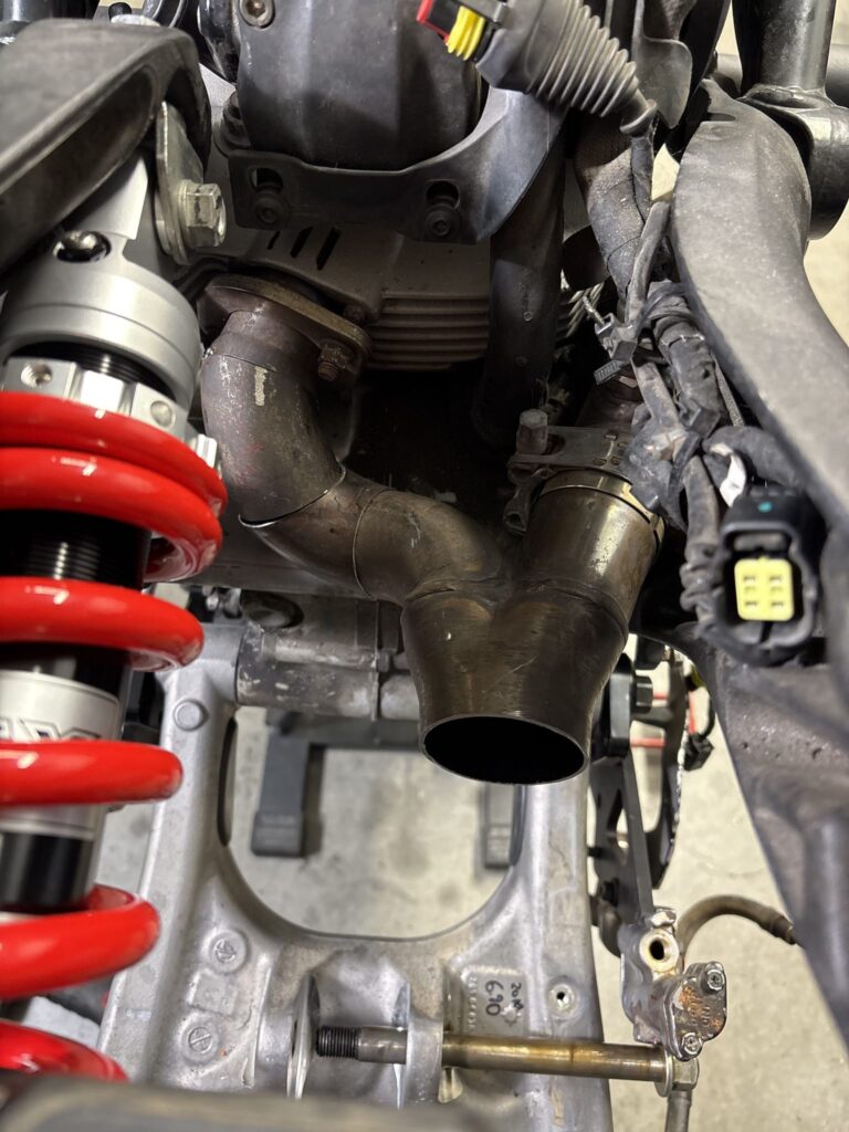 The 2-into-1 collector outlet next to the red rear shock