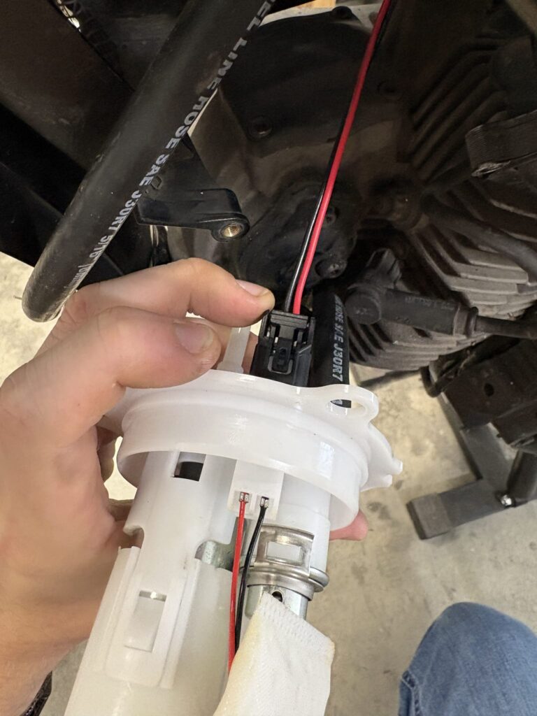 Honda TRX500 fuel pump in its white swirl pot