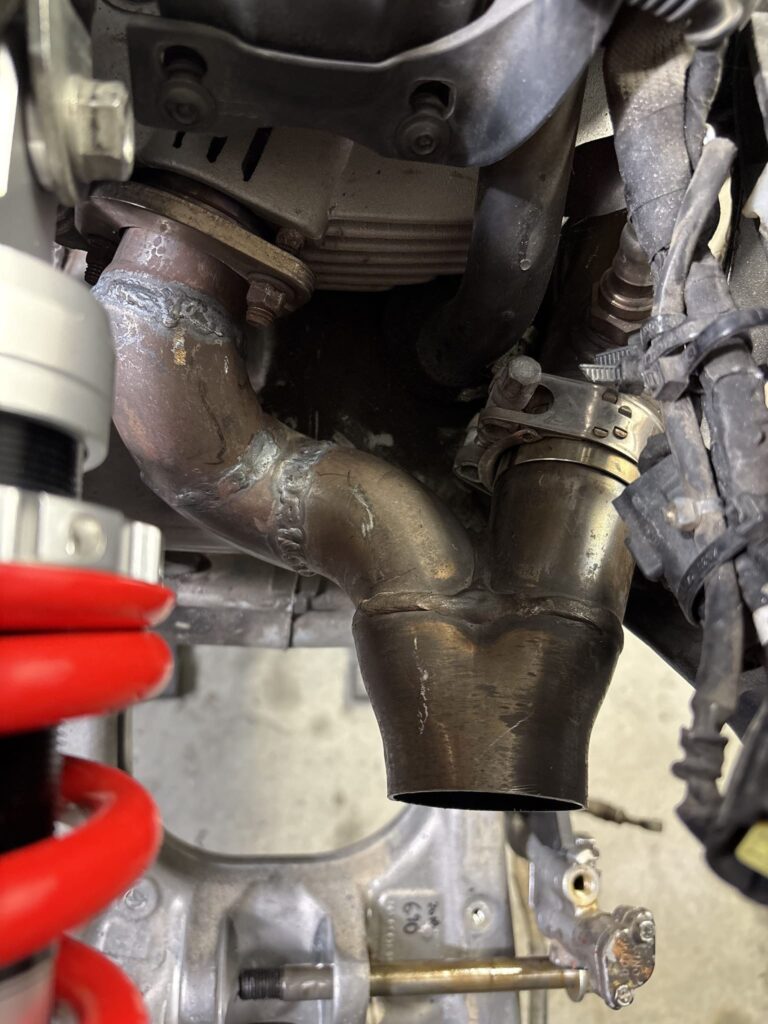 Cut and rewelded Ducati exhaust header forming a short 2-into-1