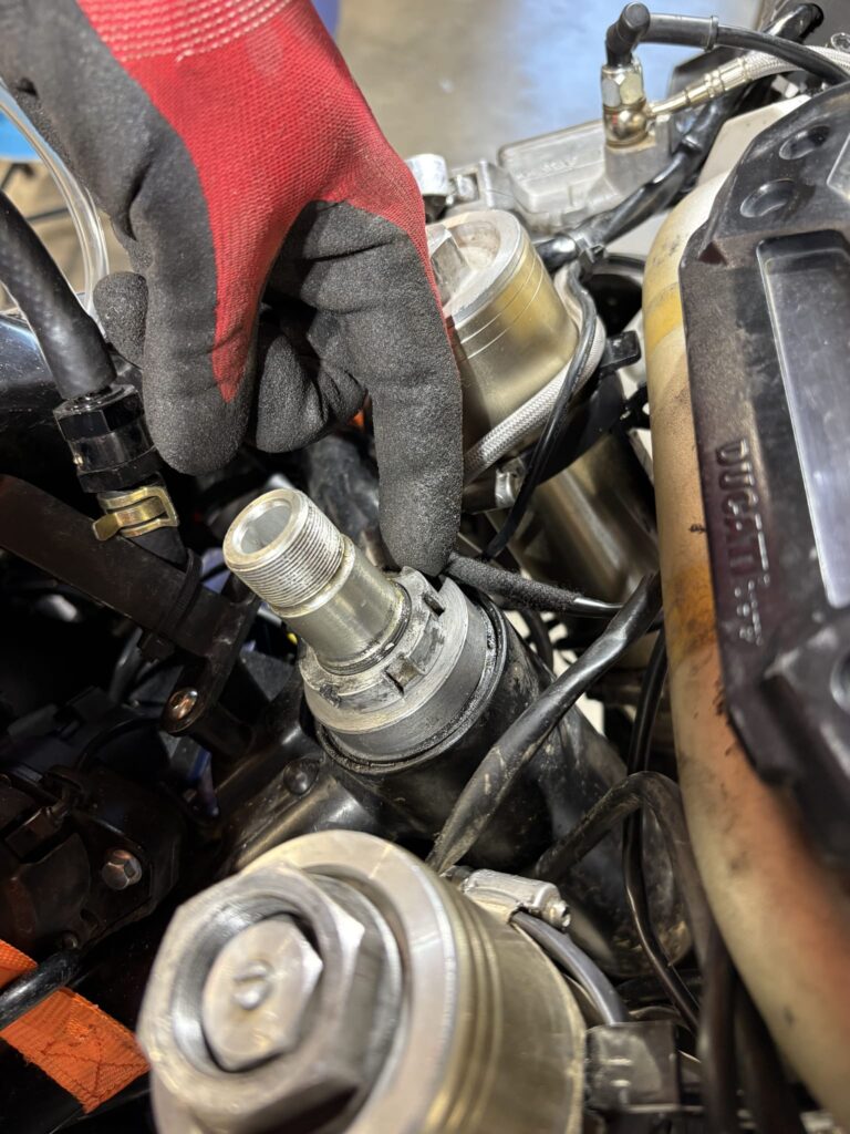 Fitting the machined spacer into the Ducati steering head