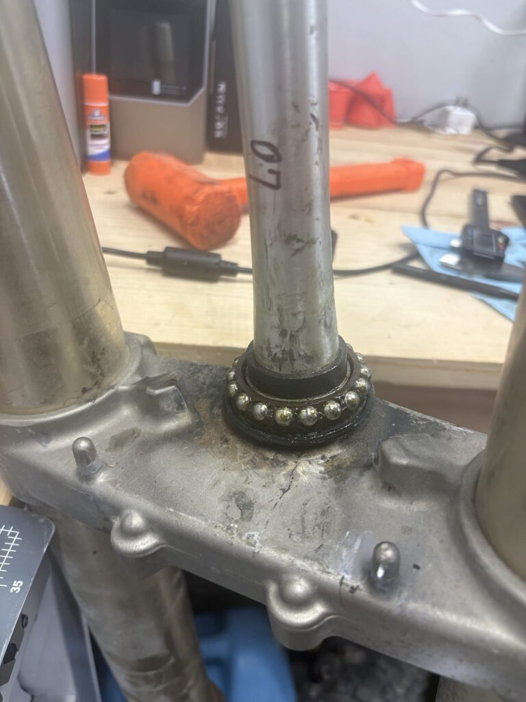 YZ450F lower triple clamp and steering stem with a steering bearing